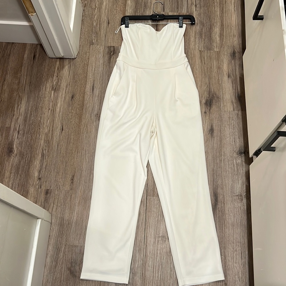 White Express Jumpsuit. Perfect for wedding rehearsal dinner. Size 2.